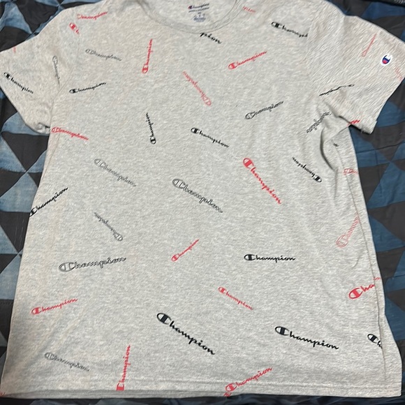 a grey/silver shirt with the word campion written in black,blue and red - Picture 1 of 2